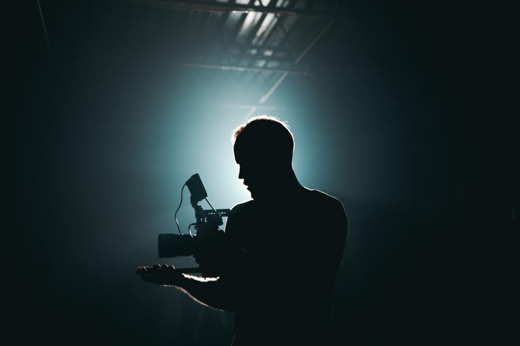 Image of a videographer. Photo by Kyle Loftus from Pexels